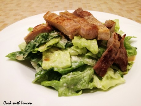 Pork steak and Roman salad with anchovy, Parmesan, olive oil and lemon juice