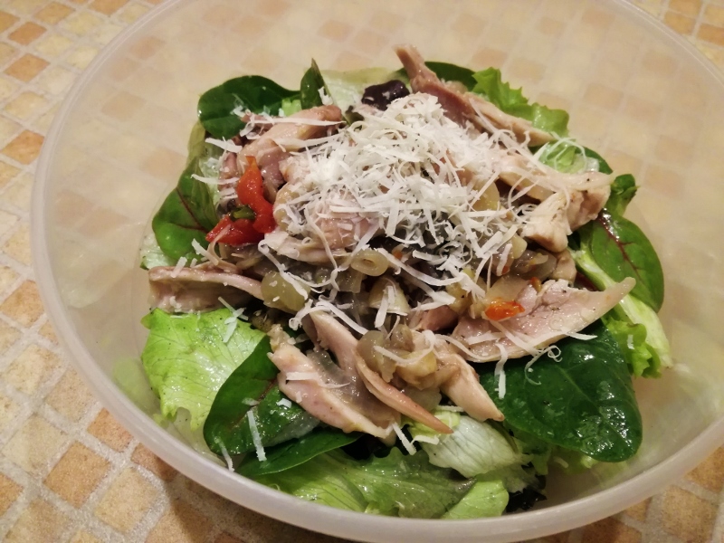 Shredded chicken with tomatoes, onion, fresh salad and Parmesan cheese