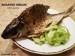 Roasted common bream with garlic, salad with lemon juice